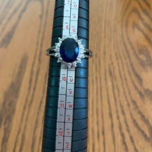 Costume ring, silver with blue sapphire
